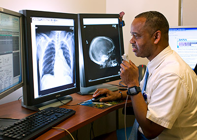 Radiologist checks diagnostic images on screen